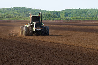 tractor raking field